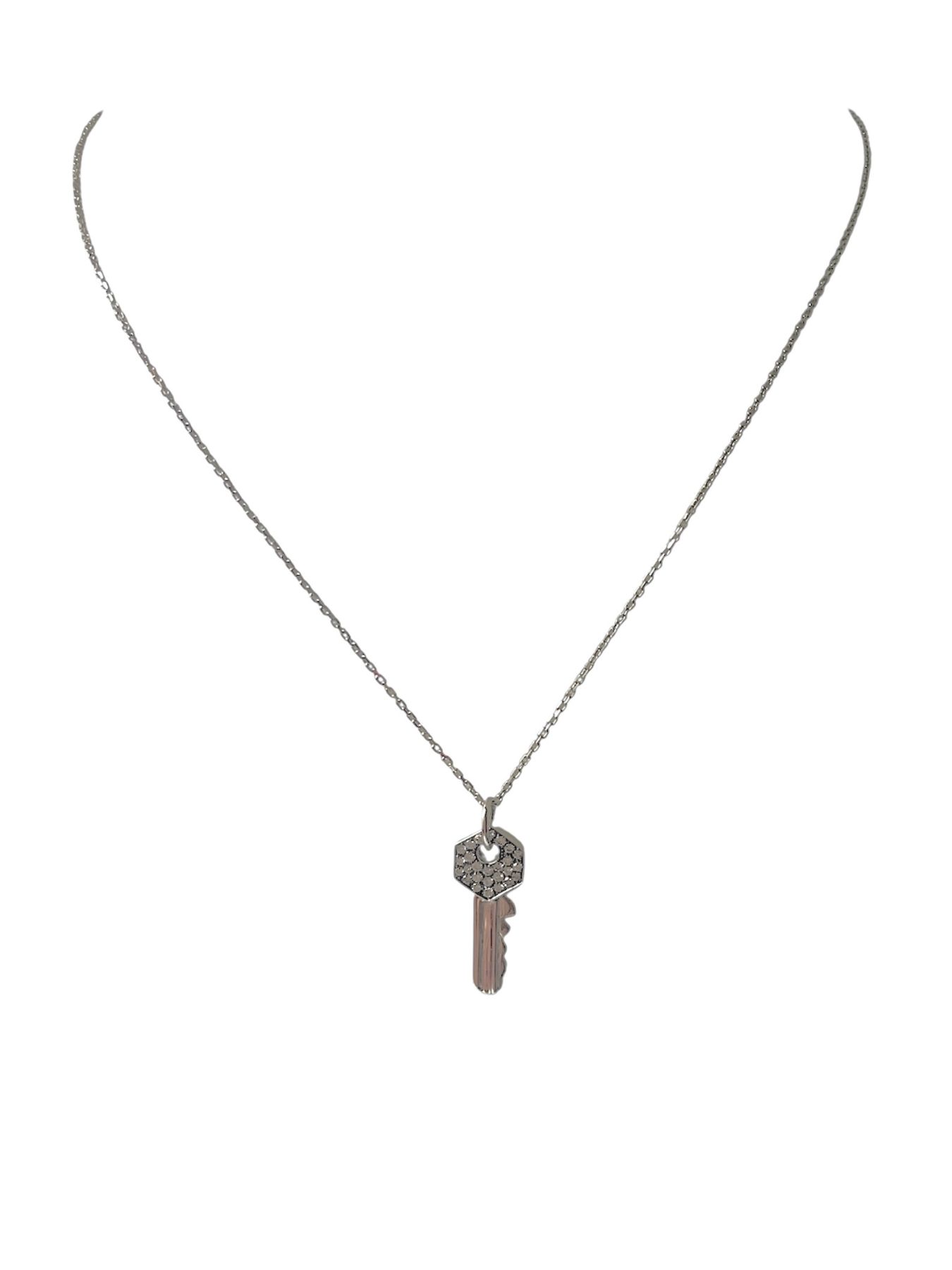 Collana in oro con chiave in diamanti